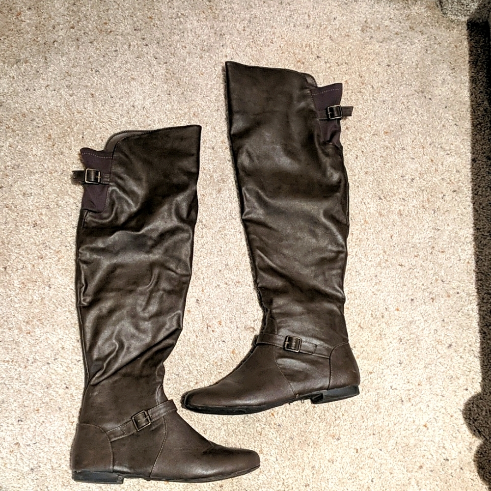 Brown over the knee boots.